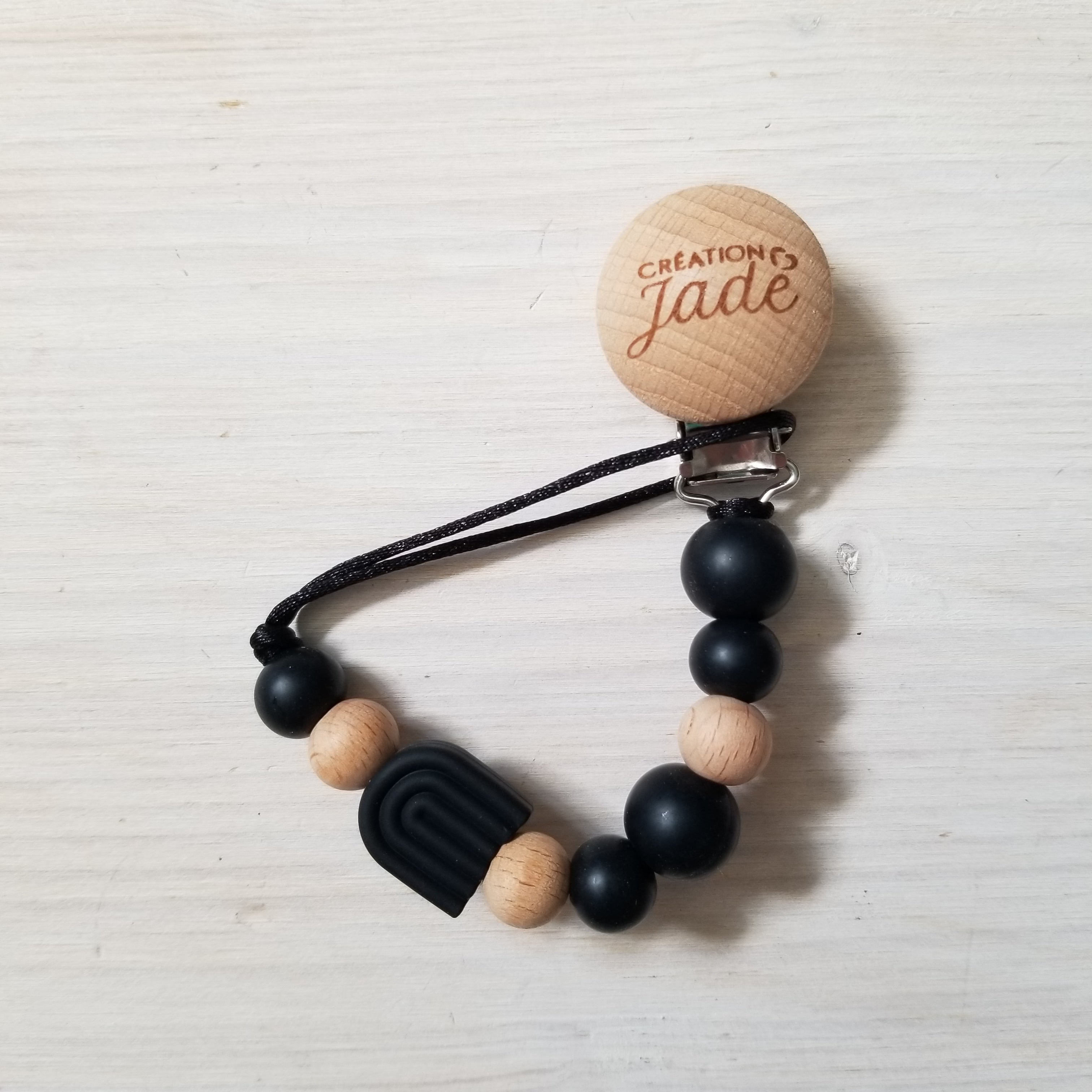 Nouveauté - Attache-suce Bois - Arc-en-ciel noir